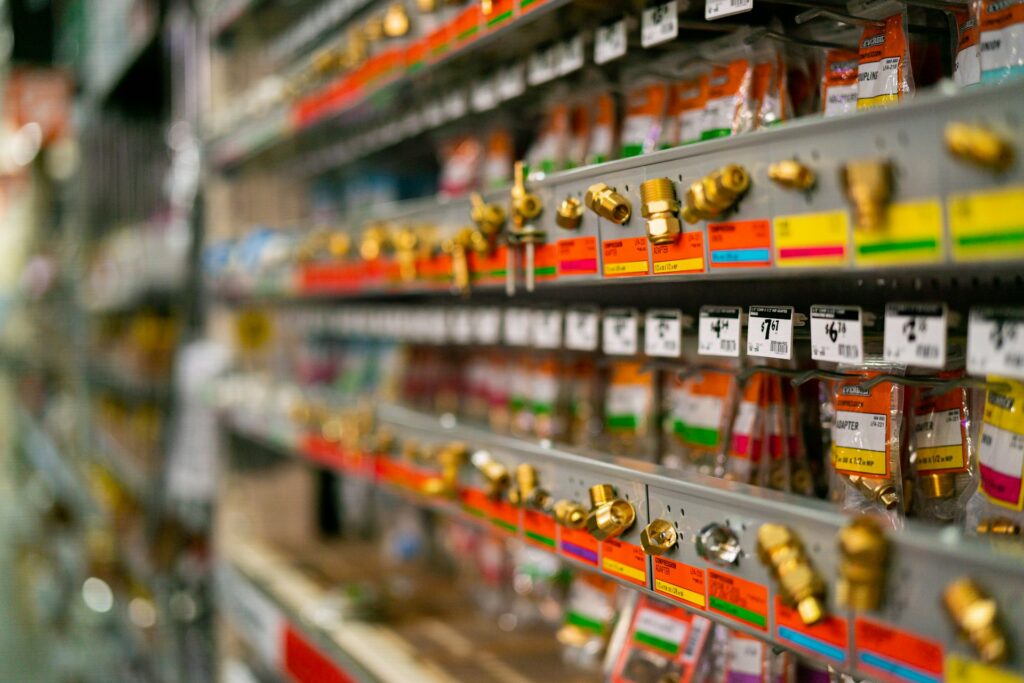 Retail shelf stocked with a wide range of packaged consumer products