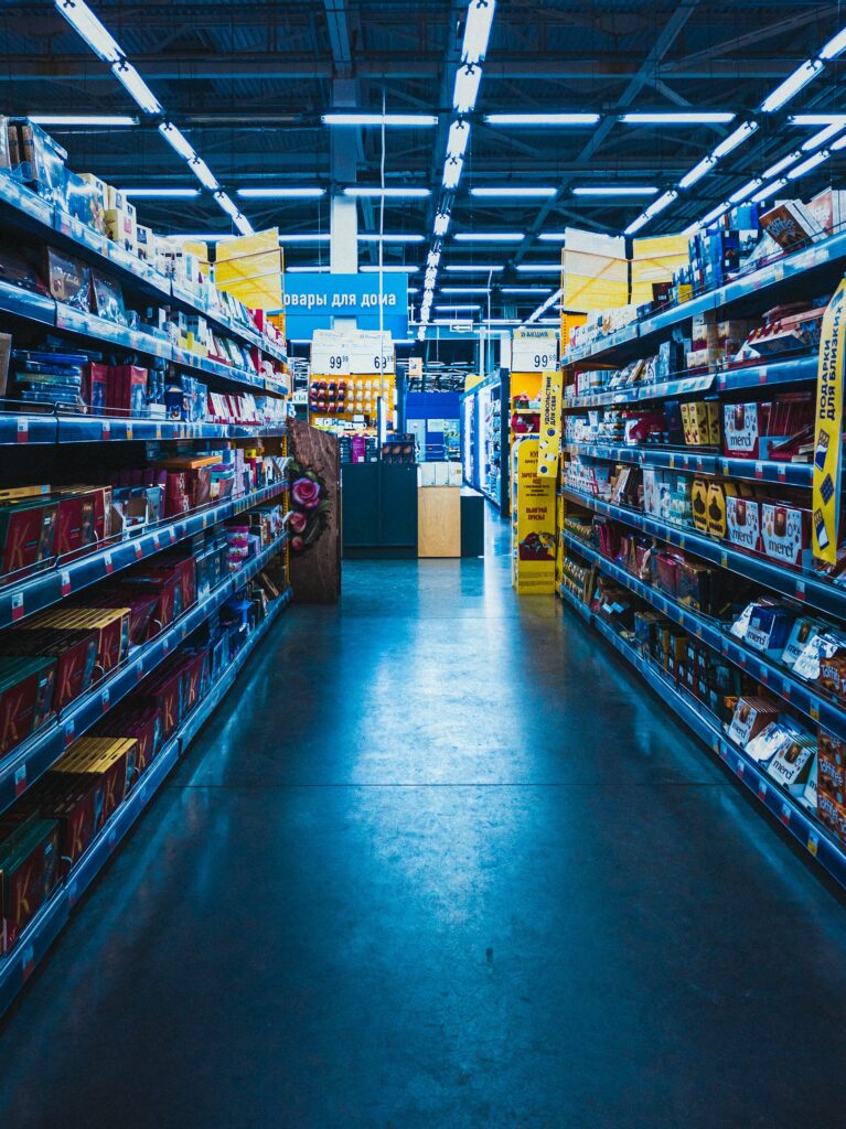 Labeled wholesale cartons from sourcing partners, received and organized in a distribution center